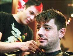 Getting his cut: Hair stylist Duane Schneider uses pay anywhere to process payments.