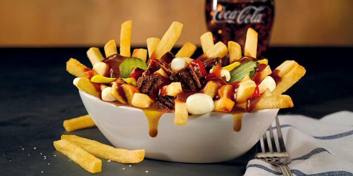 Burger King Launches the Ultimate Canadian Mashup: Poutine Topped With a Whopper