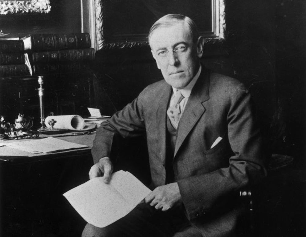 Woodrow Wilson signs Harrison Narcotics Tax Act in 1915.