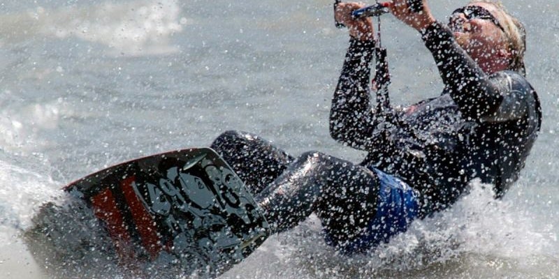 He really likes to kite-surf.