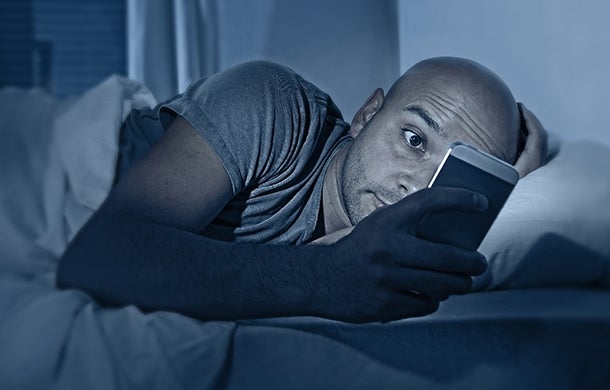 Man cuddling with phone