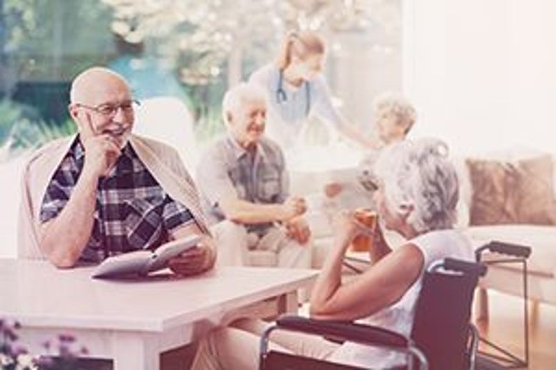 CarePatrol - Senior's reading and talking together